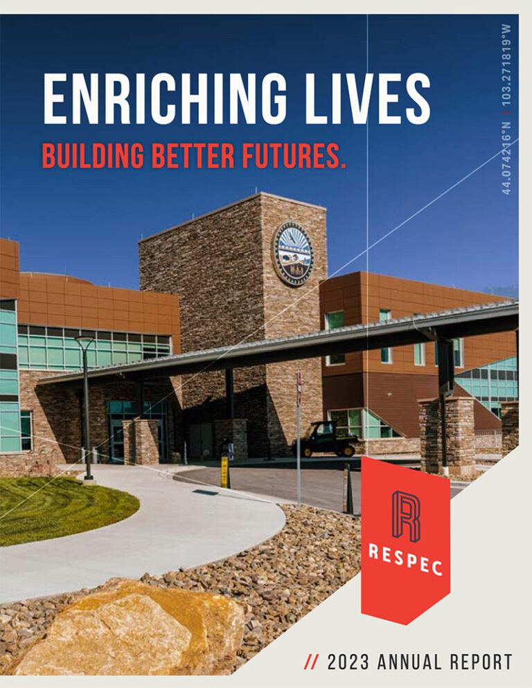 A modern brick and glass building with the RESPEC logo is shown under the headline “Enriching Lives, Building Better Futures.” The image is on the cover of RESPEC’s 2023 annual report.