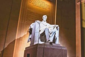 Photograph of the Lincoln Memorial and the inscription behind the statue